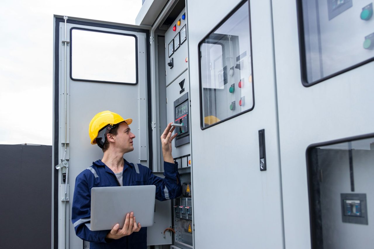Generator technician checking control panel – dependable generator and solar service in Punjab
